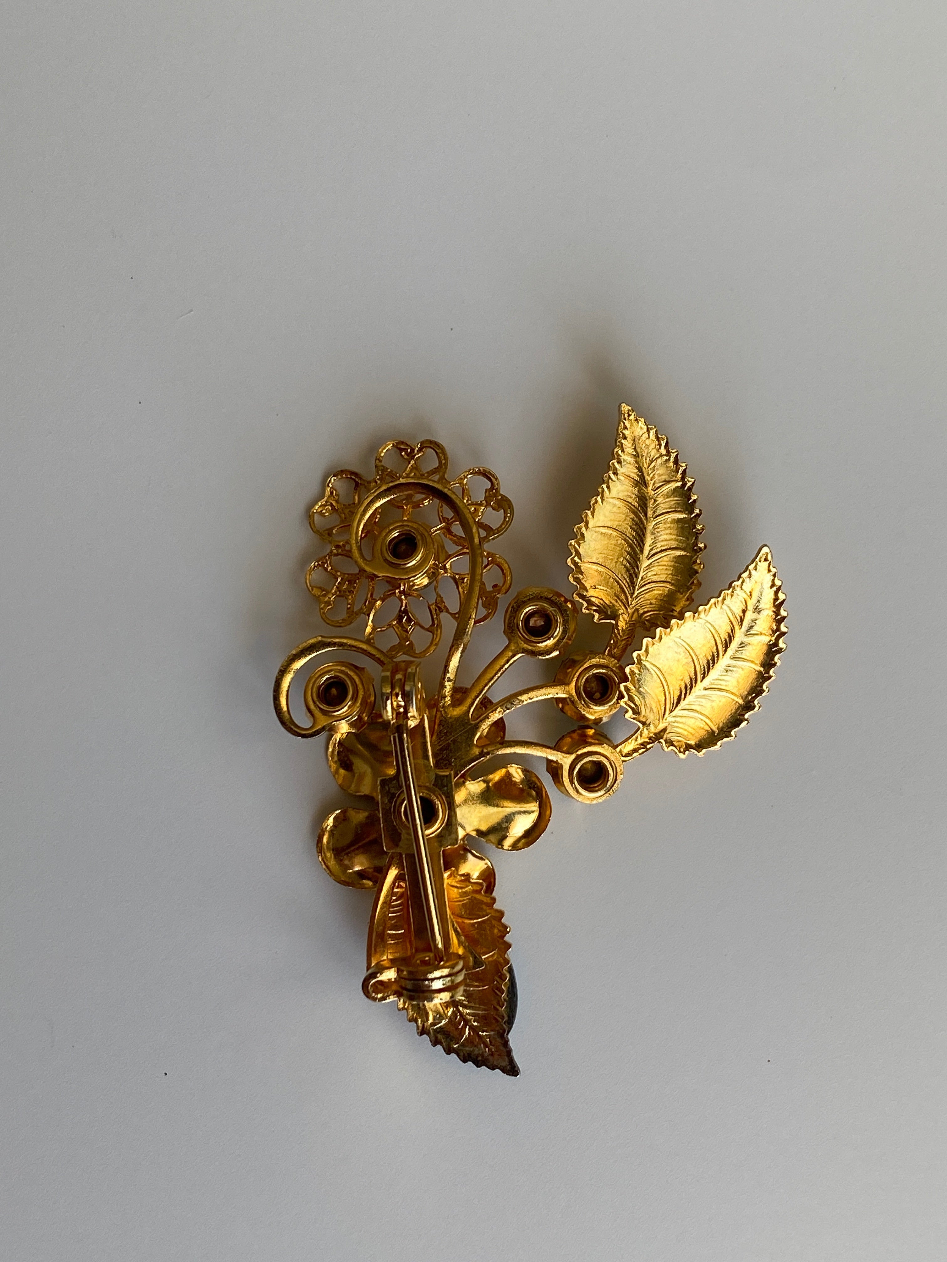 Vintage Gold Tone Blue Rhinestone Floral Spray Brooch with Cabochon Accent Pin
