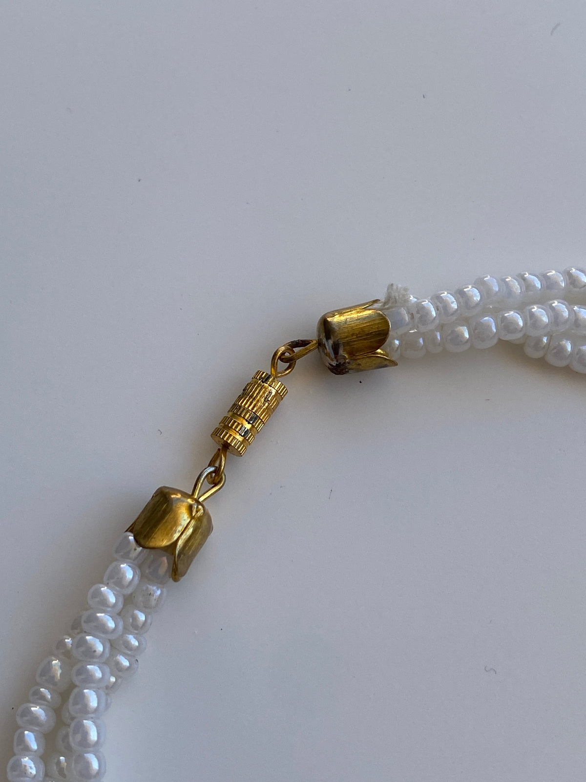 Vintage 90s/Y2K White Iridescent Seed Bead Triple-Strand Necklace with Gold-Tone Clasp
